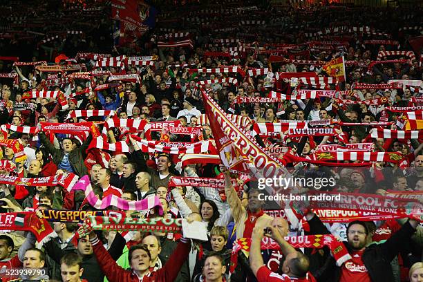 Liverpool fans holding their scarves and singing at the Kop End of Anfield during the Europa Cup Quarter Final, 2nd Leg match between Liverpool and...