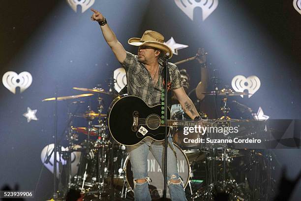 Jason Aldean performs onstage during iHeartRadio Country Festival in Austin at the Frank Erwin Center on March 29, 2014 in Austin, Texas.