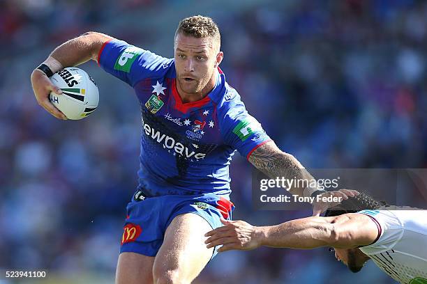 Korbin Sims of the Knights avoids a tackle during the round eight NRL match between the Newcastle Knights and the Manly Sea Eagles at Hunter Stadium...