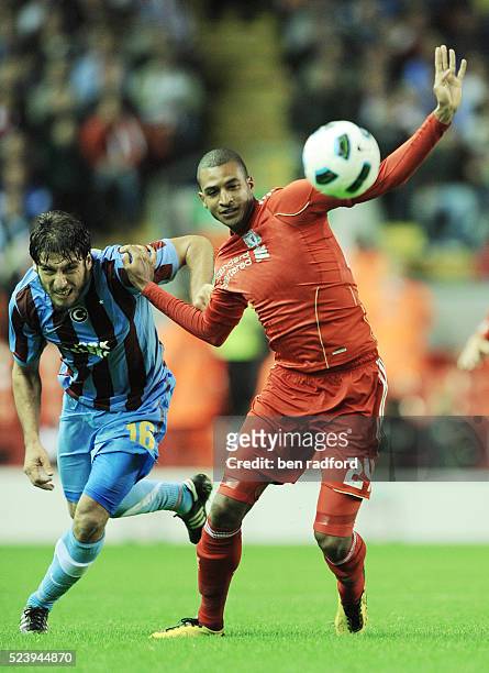 David Ngog of Liverpool and Egemen Korkmaz of Trabzonspor during the UEFA Europa League Playoff - 1st Leg match between Liverpool and Trabzonsor at...