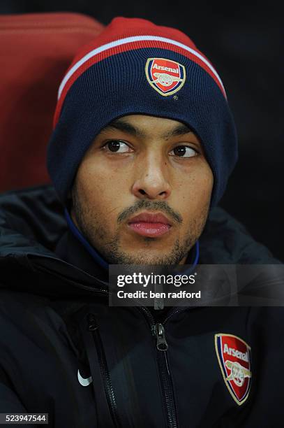 Theo Walcott of Arsenal keeps warm on the bench during the UEFA Champions League Group H match between Arsenal and Partizan Belgrade at the Emirates...