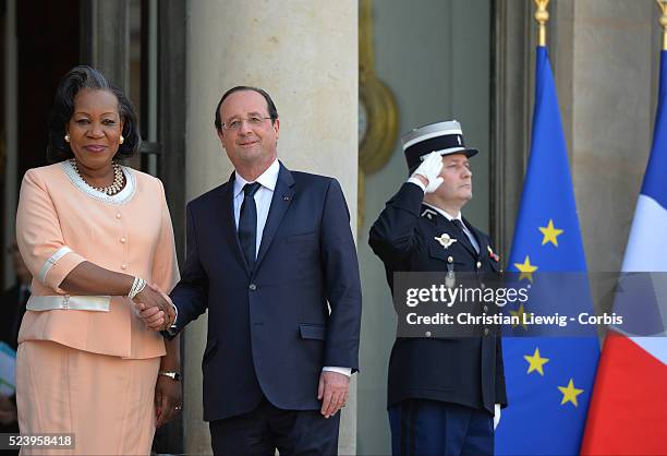 French President Francois Hollande, left, welcomes interim Central African Republic President Catherine Samba-Panza, as they pose for photographers...