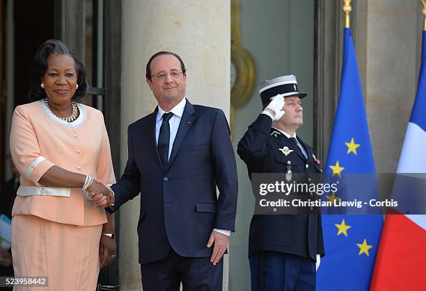 French President Francois Hollande, left, welcomes interim Central African Republic President Catherine Samba-Panza, as they pose for photographers...