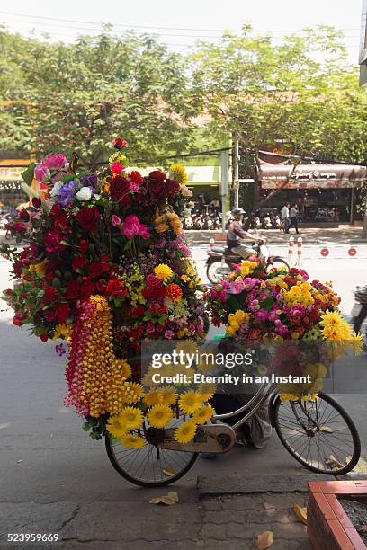 bicycle covered in flowers for sale, vietnam - flower shop stock pictures, royalty-free photos & images