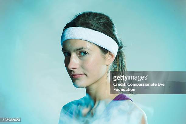 portrait of female athlete - sweat band stock pictures, royalty-free photos & images