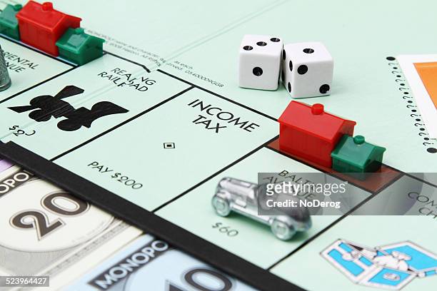 income tax on monopoly game board - monopoly go stockfoto's en -beelden