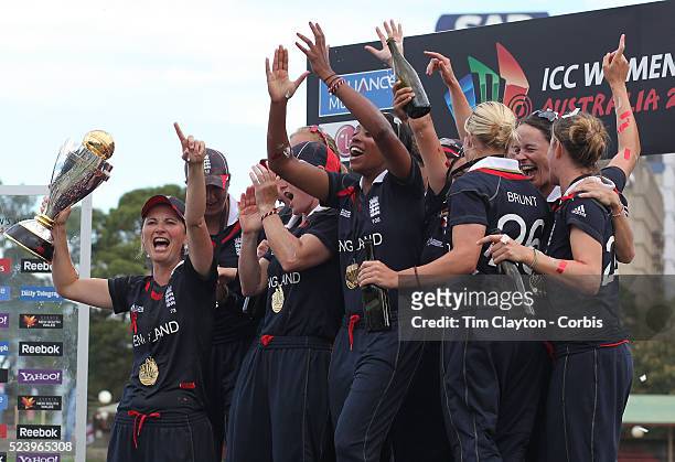 England Captain Charlotte Edwards holds the trophy as she celebrates with team mates after her teams victory in the ICC Women's World Cup Cricket...