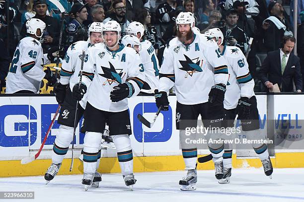 Tomas Hertl, Logan Couture, and Joe Thornton of the San Jose Sharks celebrate in Game Five of the Western Conference First Round against the Los...