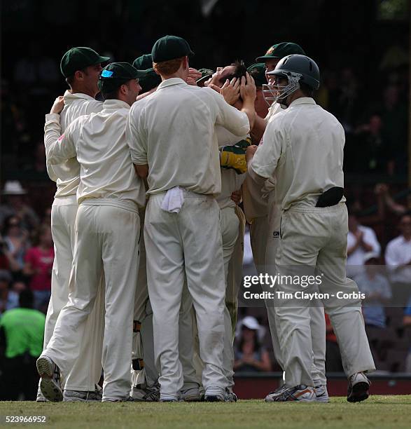 Australian bowler Mitchell Johnson celebrates with team mates after bowling South african Captain Graeme Smith to give his side victory during the...