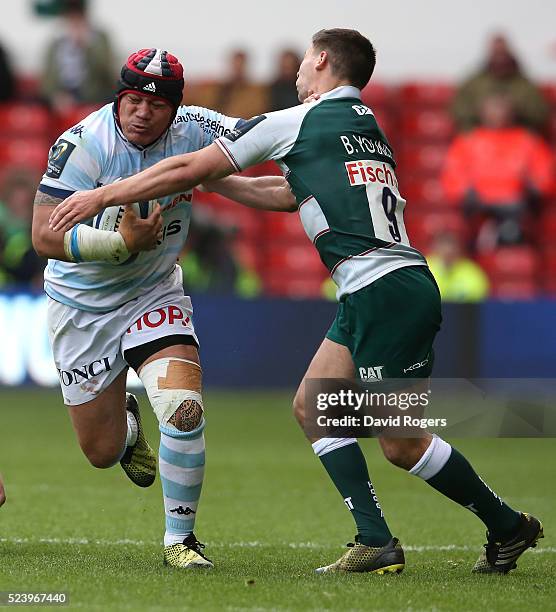 Chris Masoe of Racing 92 is held by Ben Youngs during the European Rugby Champions Cup semi final match between Leicester Tigers and Racing 92 at the...