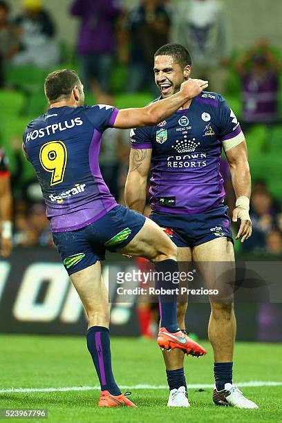 Jesse Bromwich of the Storm celebrates a try with team-mate Cameron Smith of the Storm during the round eight NRL match between the Melbourne Storm...