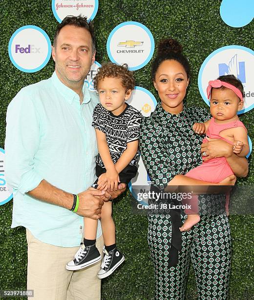 Aden John Tanner Housley, Adam Housley and Tamera Mowry attend Safe Kids Day at Smashbox Studios on April 24, 2016 in Culver City, California.