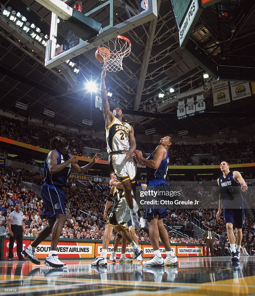 Desmond Mason of the Seattle SuperSonics shoots the ball over Juwan