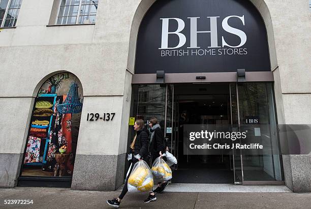 British Home Stores employees take bags out of the BHS headquarters on Marylebone Road on April 25, 2016 in London, England. High street retailer...