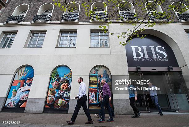 British Home Stores employees leave the BHS headquarters, where staff were told this morning that the company will go into administration on April...