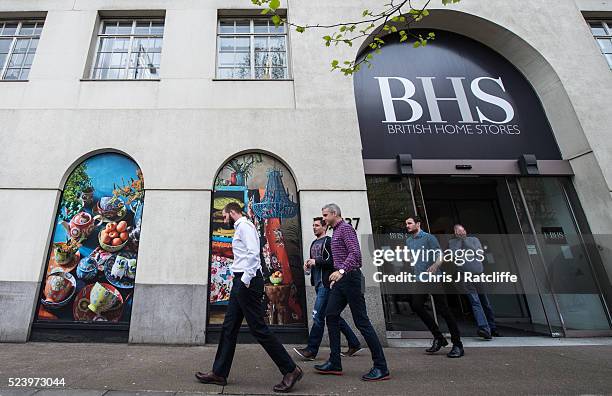 British Home Stores employees leave the BHS headquarters, where staff were told this morning that the company will go into administration on April...