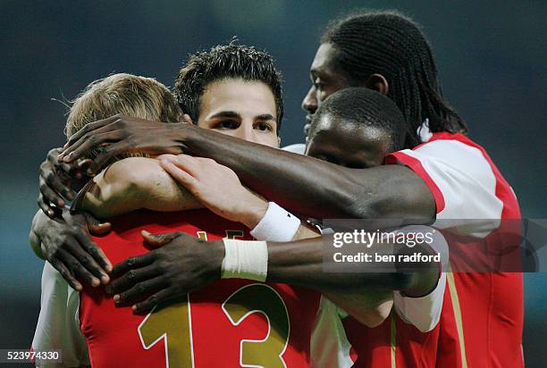 Happy Cesc Fabregas of Arsenal celebrates his first goal with Aleksandr Hleb, Emmanuel Eboue. And Emmanuel Adebayor during the Champions League Group...