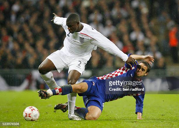 Micah Richards of England is tackled by Niko Kranjcar of Croatia during the Group E, Euro 2008 qualifier between England and Croatia at Wembley...