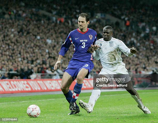 Micah Richards of England and Josip Simunic of Croatia during the Group E, Euro 2008 qualifier between England and Croatia at Wembley Stadium,...