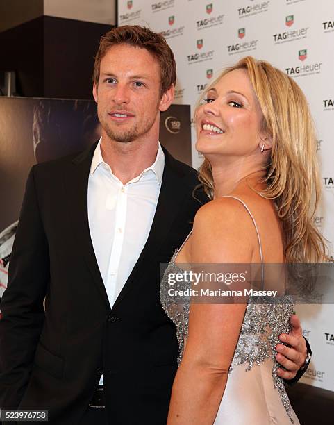 Formula 1 World Champion Jenson Button poses with actress Carla Bonner at the Tag Heuer boutique in Melbourne where he was the honoree for the night....