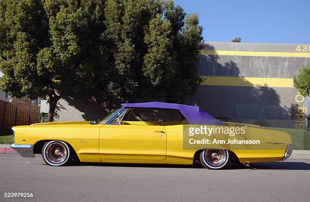 Rap artist Snoop Dogg's Lakers car, a 1967 Pontiac Parisienne, that has a hydraulic system that allows the vehicle to move up and down, was...
