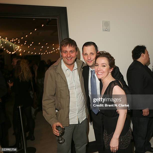 Tony Frenzel and director Domenica Cameron-Scorsese pose with a guest during the "Almost Paris" premiere after party on April 24, 2016 in New York...