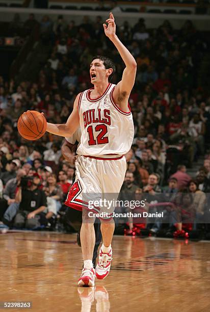 Kirk Hinrich of the Chicago Bulls moves the ball against the Sacramento Kings during the on February 15, 2005 at the United Center in Chicago,...