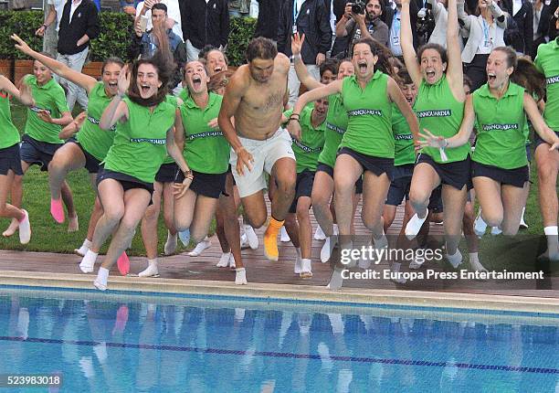 Rafa Nadal celebrates his win on the swimming pool after defeating Kei Nishikori of Japan in their final match during the Barcelona Open Banc...