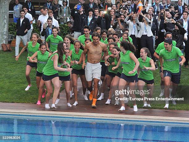 Rafa Nadal celebrates his win on the swimming pool after defeating Kei Nishikori of Japan in their final match during the Barcelona Open Banc...