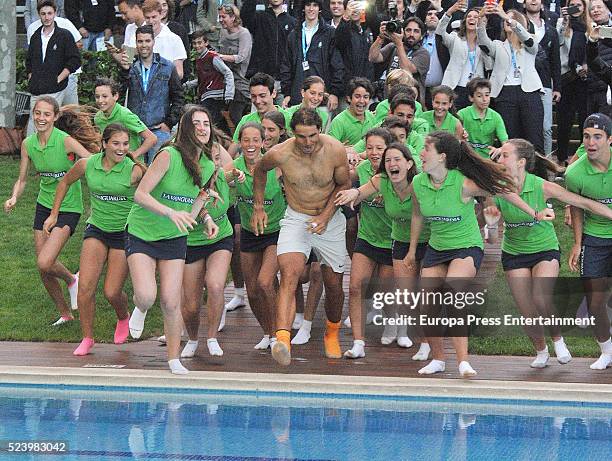 Rafa Nadal celebrates his win on the swimming pool after defeating Kei Nishikori of Japan in their final match during the Barcelona Open Banc...