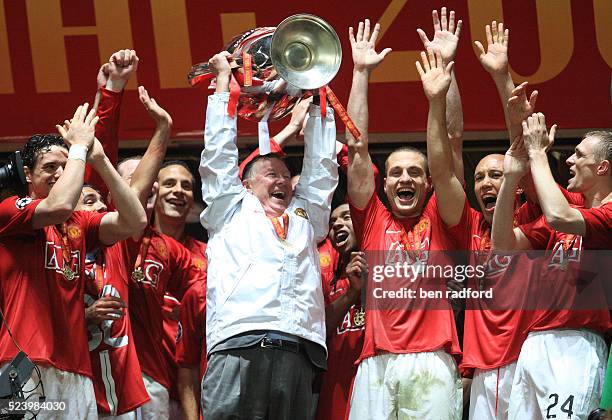 Manchester United's Manager Sir Alex Ferguson holds aloft the European Cup and celebrates with his players after winning the UEFA Champions League...