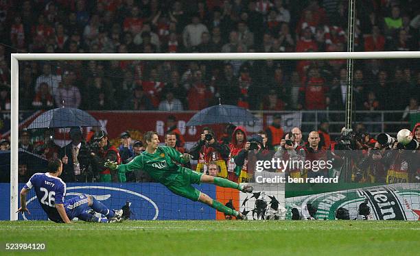 John Terry of Chelsea sends his penalty wide of the goal as Edwin Van Der Sar of Manchester United dives during the UEFA Champions League Final...