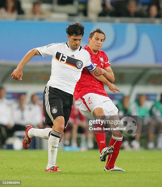 Michael Ballack of Germany battles with Dariusz Dudka of Poland during the UEFA Euro 2008, Group B match between Germany and Poland at the Worthersee...