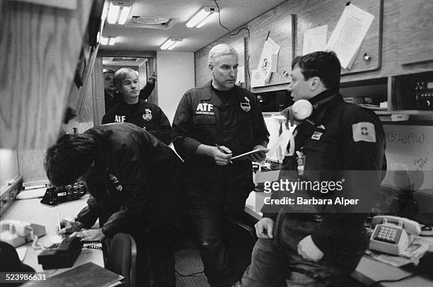 Officers from the Bureau of Alcohol, Tobacco, Firearms and Explosives inside their van at the World Trade Center days after a truck bomb is detonated...