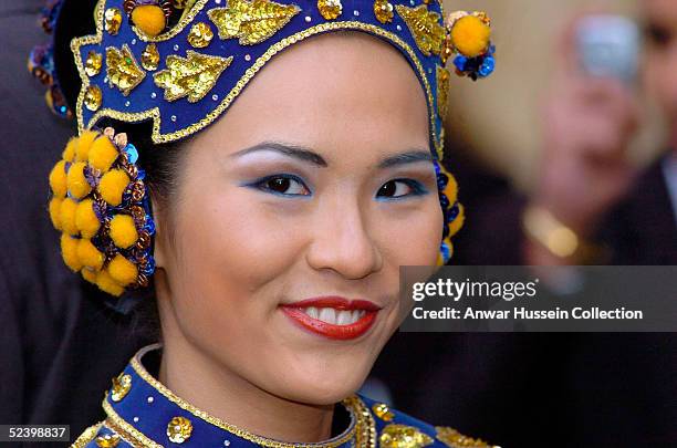 Hian-Ping, from Kuala Lumpur in Malaysia arrives for an Observance for Commonwealth Day 2005 service held at Westminster Abbey in central London on...