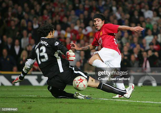 Carlos Tevez of Manchester United sees his shot saved by Villarreal goalkeeper Diego Lopez during the Group E, UEFA Champions League match between...