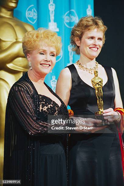 Presenter Debbie Reynolds with Rachel Portman, winner of the Best Original Musical Score Oscar for Emma at the 69th annual Academy Awards.