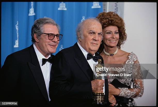 Marcello Mastroianni, Federico Fellini, and Sophia Loren attend the 65th Academy Awards in Los Angeles. Fellini was given an honorary award in...