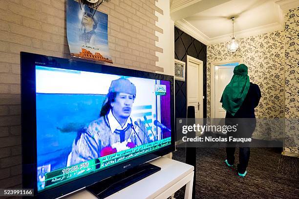 In the lounge of Chahd, refugee since September 25th former victim of rapes in Tripoli by rebels, the TV " el Khadra " diffuse in buckles of the...
