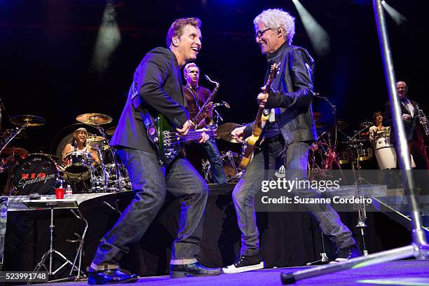 Musicians Jason Scheff, Kevin Cronin, and Walter Parazaider perform in concert with Chicago and REO Speedwagon at Cedar Park Center on August 27,...