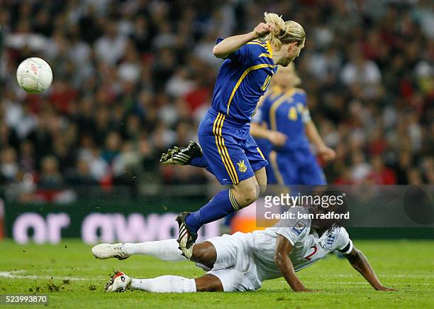Glen Johnson of England and Andriy Voronin of Ukraine during the Group Six, FIFA 2010 World Cup qualifying match between England and Ukraine at...