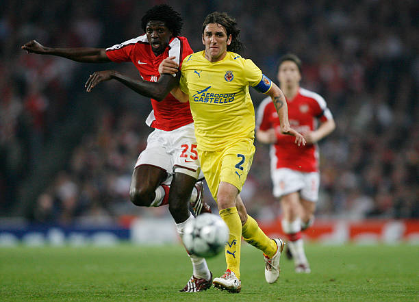 Emmanuel Adebayor of Arsenal and Gonzalo Rodriguez of Villarreal during the UEFA Champions League Quarter Final 2nd Leg match between Arsenal and...