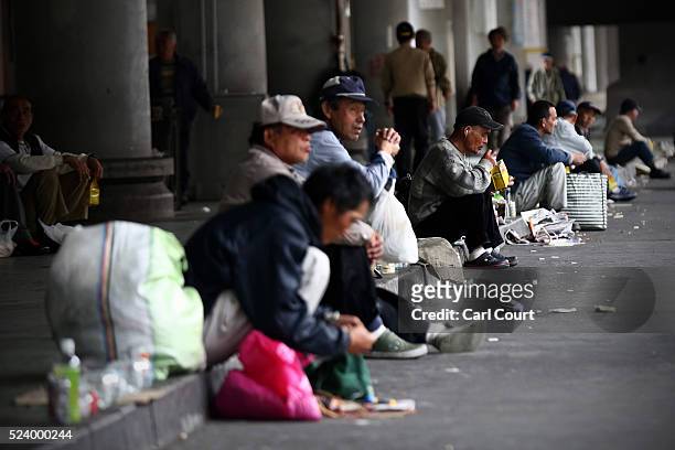 Homeless men wait around for the offer of work in the slum area of Kamagasaki on April 24, 2016 in Osaka, Japan. Kamagasaki, a district in Japan's...