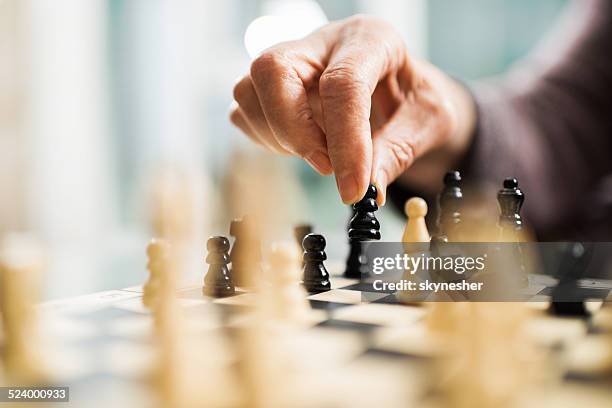 playing chess. - schaken stockfoto's en -beelden