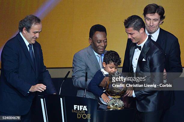 Ballon d'Or winner Cristiano Ronaldo of Portugal and Real Madrid looks on with son Cristiano Ronaldo Junior during the FIFA Ballon d'Or Gala 2013 at...
