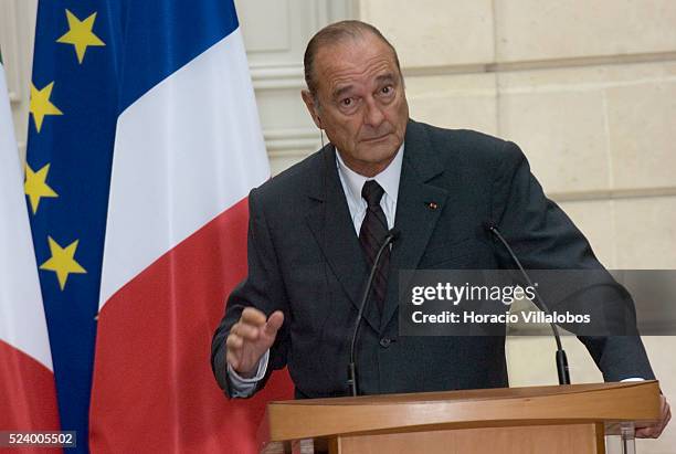 French President Jacques Chirac listens to a question during the joint press conference he gave with Italian Prime Minister Silvio Berlusconi at the...