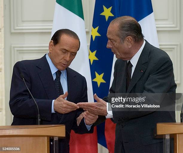 French President Jacques Chirac and Italian Prime Minister Silvio Berlusconi gesture during the joint press conference they gave at the Elysee Palace...