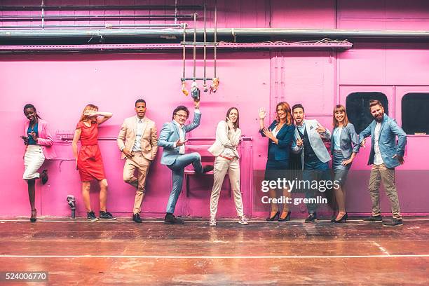 group of business people making funny faces and gestures - body language stockfoto's en -beelden