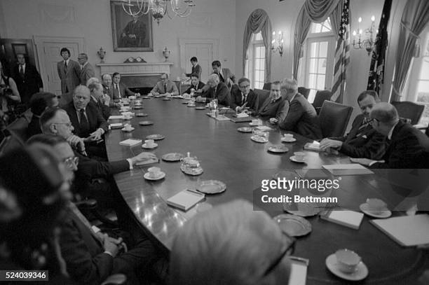 Vice President Gerald Ford sits across the table from President Nixon during cabinet meeting at the White House Aug 6th. Clockwise from left are:...