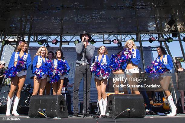 Country star Trace Adkins performs in concert surrounded by the Dallas Cowboys Cheerleaders at Carnival's Ultimate Cowboys Fan Fest on October 18,...